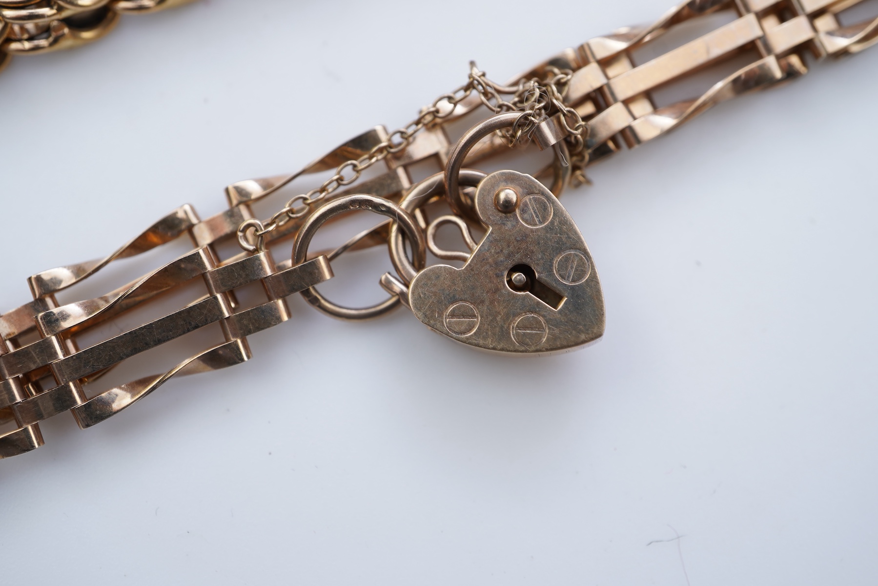 Two gold bracelets and a gold necklace